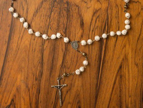 Demonstrating the anatomy of a rosary 