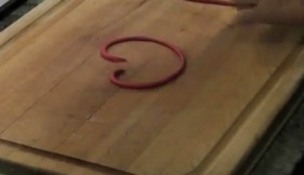 Demonstrating how to shape the heart pendant