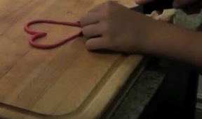 Demonstrating how to shape the bottom corner