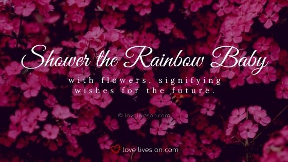 Shower the rainbow baby with flowers