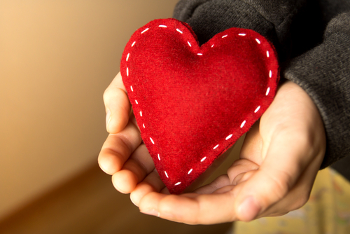 Cover image of hands holding a felt heart