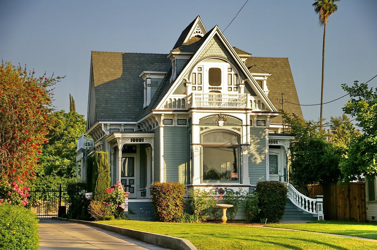 Cover image of a historic funeral home with front lawn and gardens