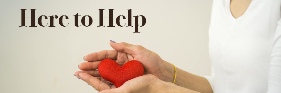 Subheading graphic with text overlay: Here to Help. Background is hands holding a heart.